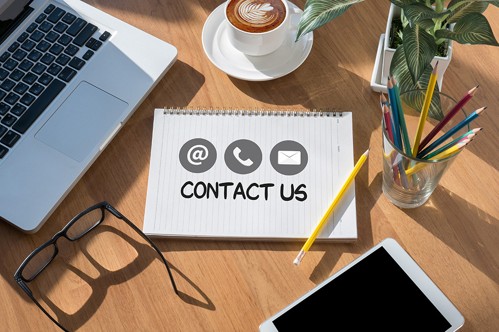contact us graphic over desk top